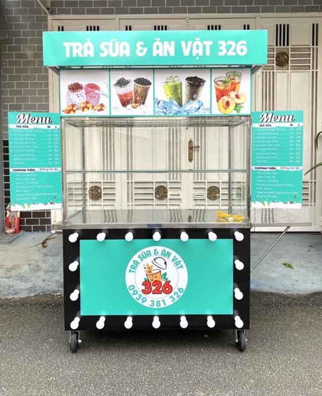 Xe bán trà sữa vỉa hè nền xanh 
